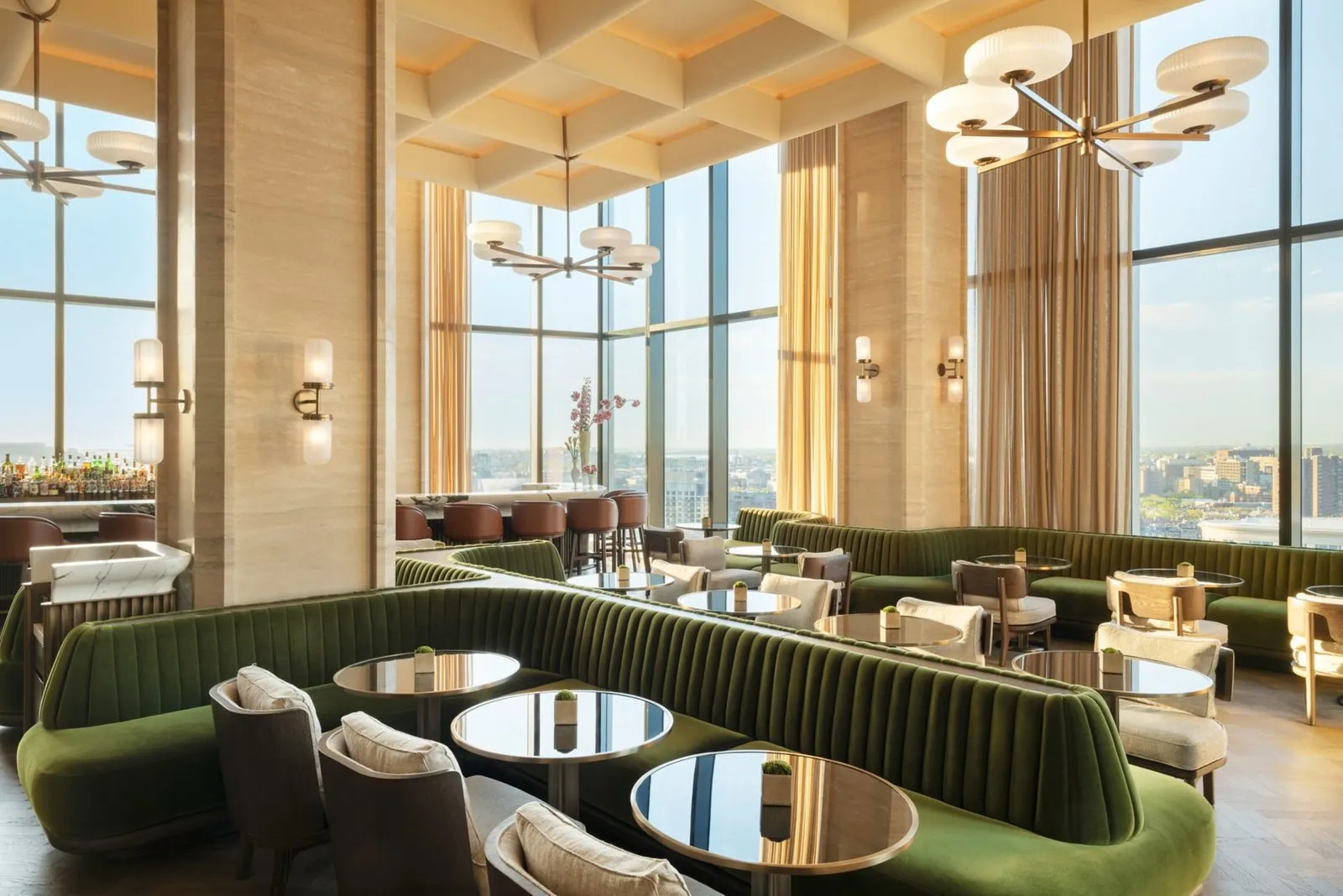 Seating beside the tall windows at Long Bar & Terrace