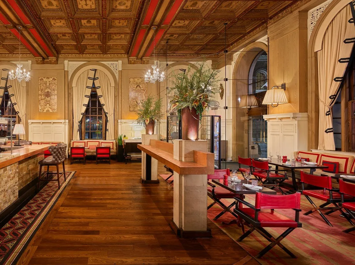 The ornate dining room and copper bar at OAK Long Bar + Kitchen